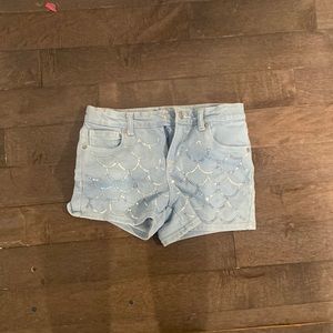 blue jean shorts with mermaid pattern